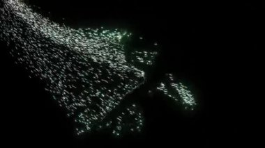 Tanımlanamayan parçacıklardan oluşan bir insan figürü siyah bir arkaplanda parçacıklardan oluşan bir iz bırakıyor. Tasarım. Uzay evreninde kusursuz bir döngüde uçan bir insanın ruhu..