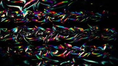 Karanlık yavaş hareket eden dalgalı bir arka plan, pürüzsüz bir döngü. Hareket. Renkli lekeleri yavaşça dalgalanan siyah yapışkan madde..