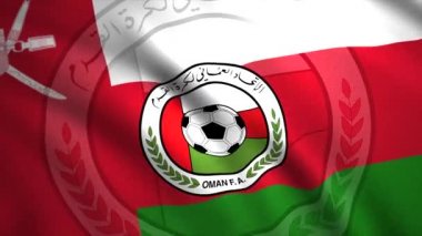 Umman Futbol Federasyonu bayrağı. Hareket. Kırmızı, beyaz ve yeşil bayrak, amblemde top var. Sadece yazı işleri için..
