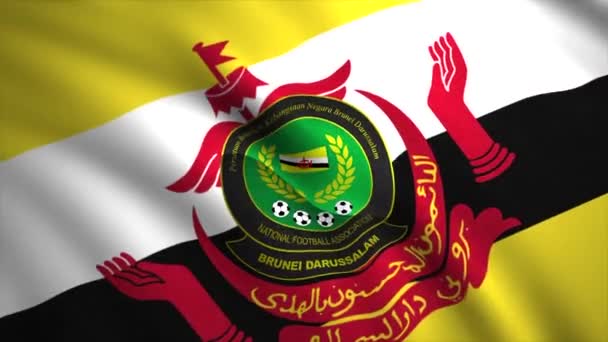 Diagonal widok machania kolorowe flagi Football Association of Brunei Darussalam. - Wniosek. Realistyczna kontrastująca flaga trzepocząca na wietrze, płynna pętla. Wyłącznie do użytku redakcyjnego. — Wideo stockowe