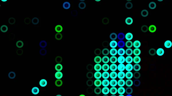 Beaucoup de petits cercles multicolores se déplaçant sur un fond noir. Motion. Beaux cercles de même taille suivant un par un dans les rangées. — Photo
