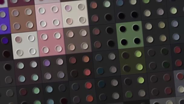 Abstract rotating surface divided into the rows of same size squares. Motion. Tiles with four circles spinning and changing color. — Vídeo de Stock