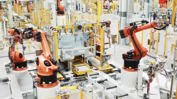 Latest technology in machine production. Scene. Robotic machines working in production of cars and parts. New technologies and robotization in production — Stock Video