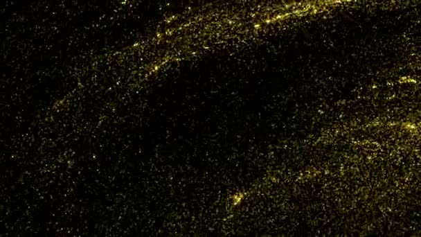 Liquid golden abstract background with flowing shining particles on a black background. Motion. Beautiful wavy texture with yellow shining dust. — Stockvideo