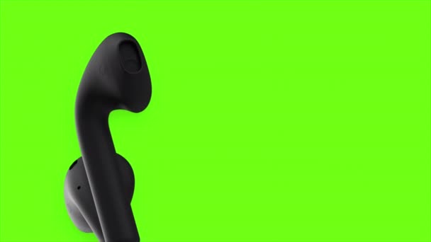 Green background. Motion. Black wireless headphones move in abstraction on a bright background. — Stock Video