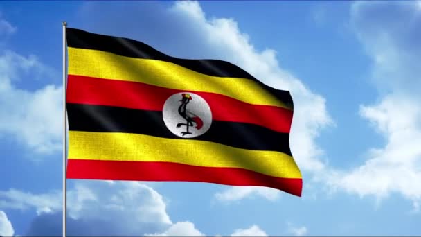 O símbolo nacional de Uganda. Moção. Uma bandeira brilhante com listras amarelas e vermelhas pretas em um céu azul. — Vídeo de Stock