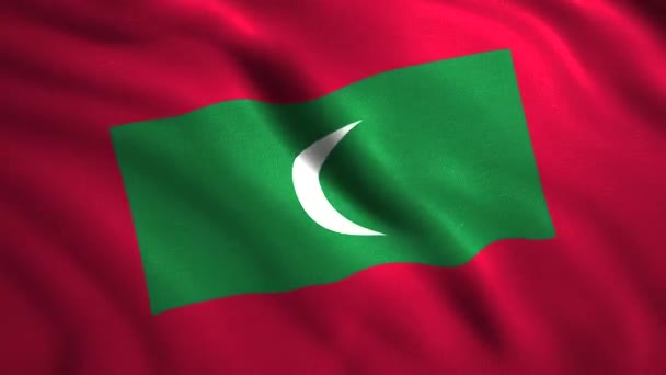 Kain bendera Maladewa bergoyang dalam angin, loop mulus. Gerak. Bulan sabit dan pada latar belakang hijau dan merah. — Stok Video