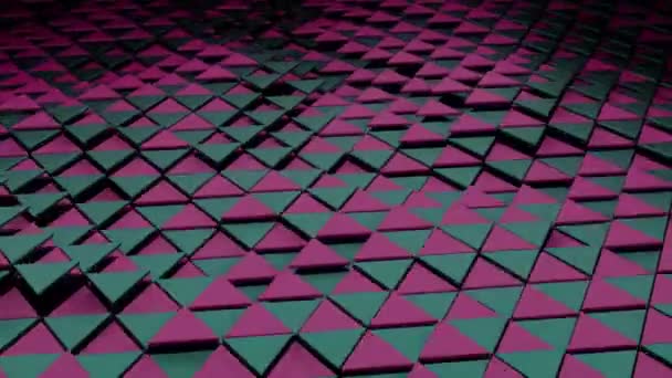 Сірі і рожеві маленькі трикутники. Трикутники, розташовані з різних сторін у 3d форматі, піднімаються і падають назад. — стокове відео