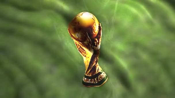 Abstrakt gyllene FIFA World Cup Trophy på ett grönt tyg av en flagga. Rörelse. Viftar sport flagga, sömlös loop. Endast för redaktionellt bruk. — Stockvideo
