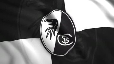 Alman futbol takımının amblemli bayrağı. Hareket. Üzerinde futbol takımı logosu olan güzel bir bayrak sallıyor. Freiburg futbol takımının bayrağı.