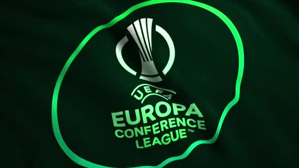 Primo piano di un emblema astratto della UEFA Europa Conference League. Mozione. Sfondo realistico ondulante, loop senza soluzione di continuità. Solo per uso editoriale. — Video Stock