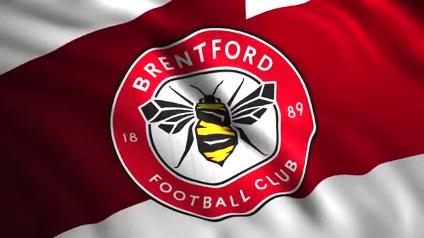 Symbolen för Brentford.Motion.En ljus bakgrund med emblemet för en engelsk professionell fotbollsklubb från staden med samma namn i Hounslow distriktet i västra Greater London. — Stockvideo