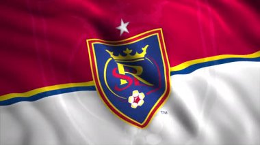 Futbol kulübünün bayrağını geliştirmenin animasyonu. Hareket. Rüzgarda hareket eden güzel bir 3 boyutlu bayrak ve futbol kulübü logosu. Amerikan Futbol Kulübü Gerçek Tuz Gölü