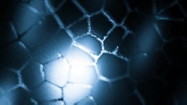 Mavi arkaplan. Hareket. Sarı ışık ışınlarının düştüğü ışık arkaplanı animasyonda dönüyor. Yüksek kalite 4k görüntü