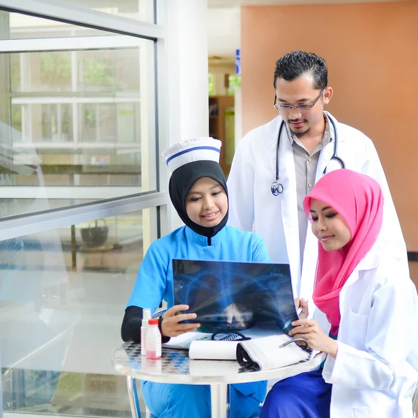 Confident Muslim doctor busy conversation at hospital — Stock fotografie