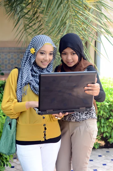 Close-up portrait of beautiful young Asian girl in head scarf — Stock Photo, Image