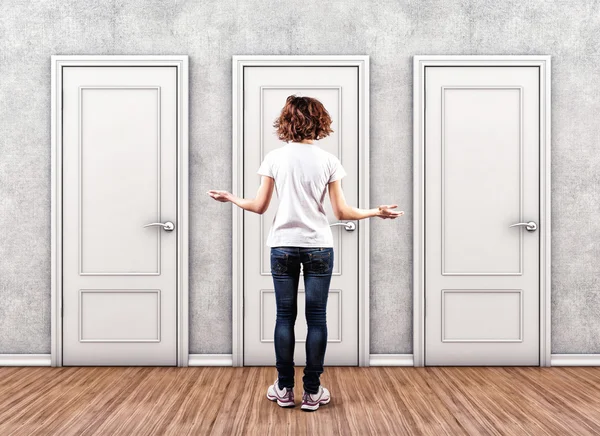 Girl before a doors — Stock Photo, Image