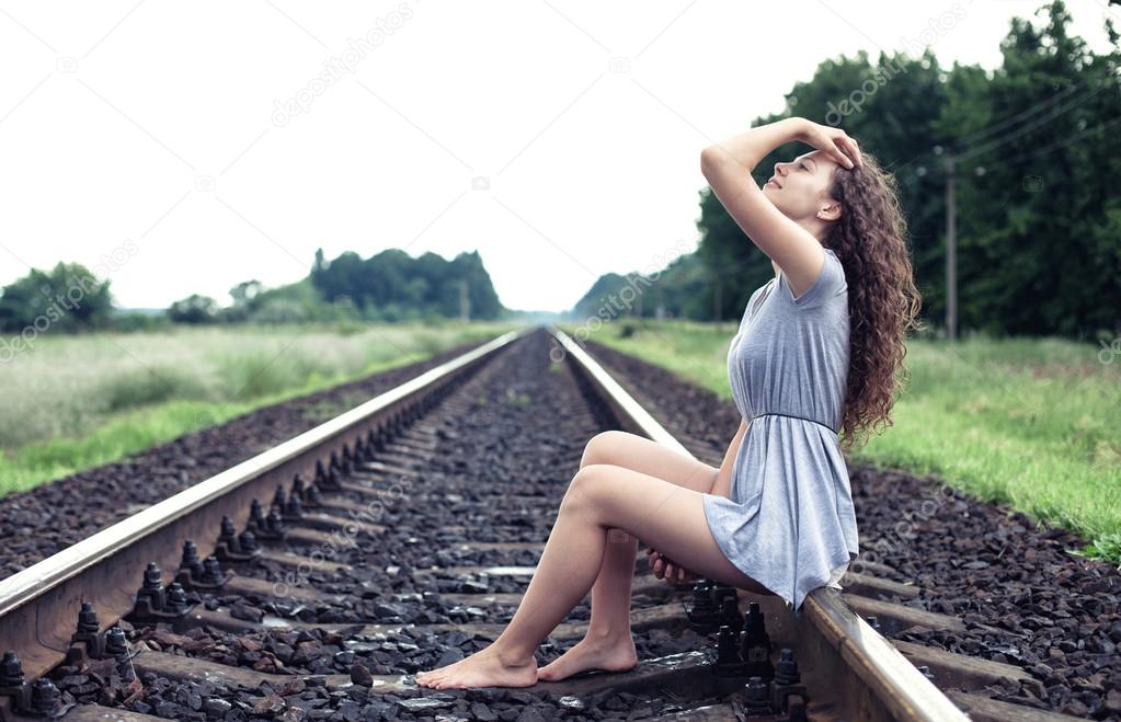 https://st.depositphotos.com/1192014/4983/i/950/depositphotos_49839293-stock-photo-girl-on-the-railway.jpg