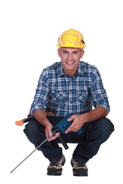 Workman with a masonry drill — Stock Photo, Image