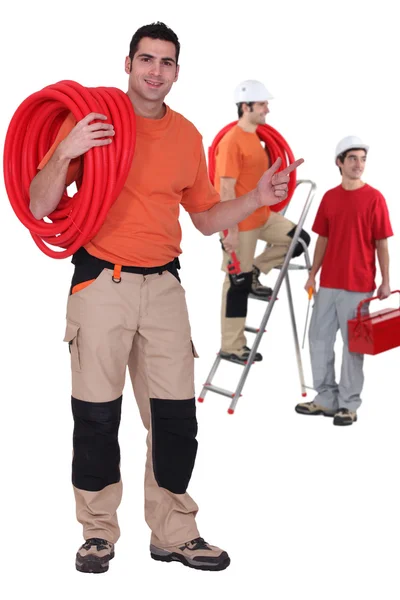 Three plumbers — Stock Photo, Image