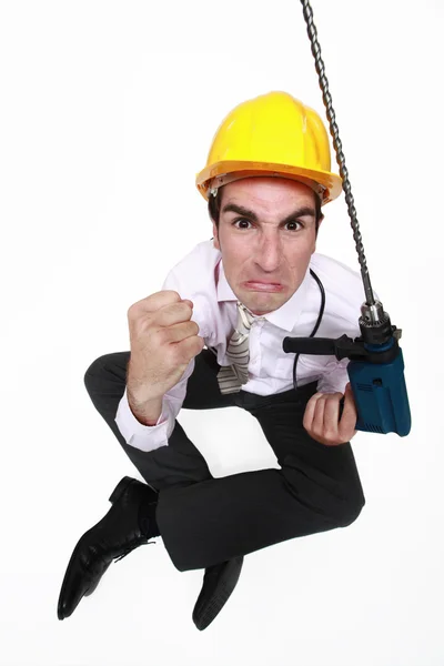 A pissed architect with a drill. — Stock Photo, Image