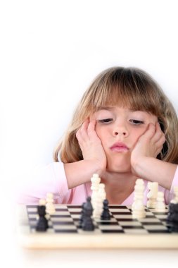 Girl playing chess clipart