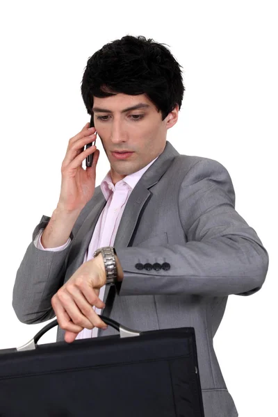 Businessman trying to stay on schedule — Stock Photo, Image