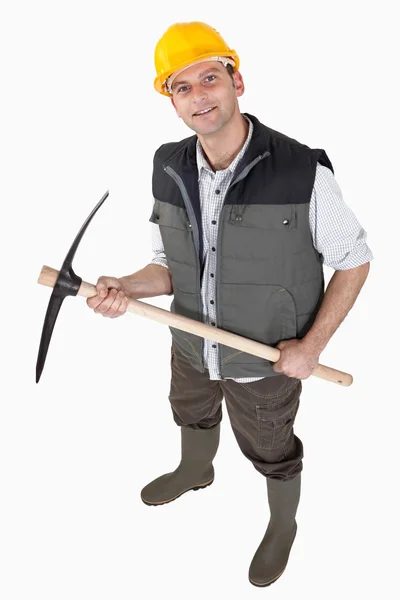 Bricklayer holding pickaxe — Stock Photo, Image