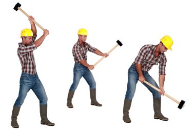 Tradesman laboriously using a mallet clipart