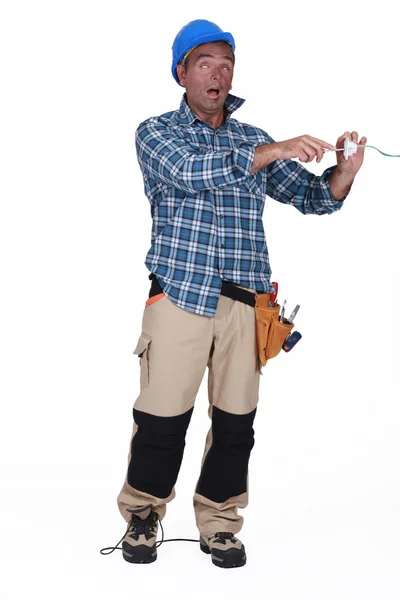 Electrician having an electric shock — Stock Photo, Image
