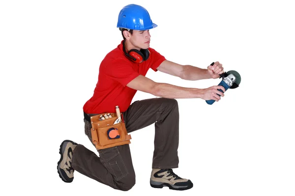 Handwerker in der Hand einer elektrischen Säge — Stockfoto