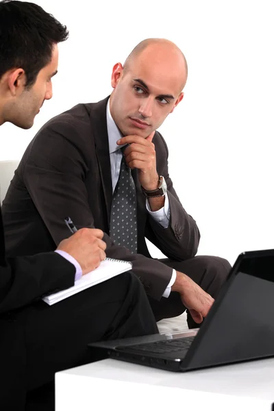 Two businessmen waiting for client Royalty Free Stock Images