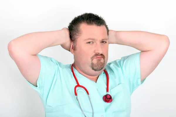Doctor with his hands behind his head — Stock Photo, Image