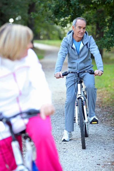 Senior biking — Stock Photo, Image