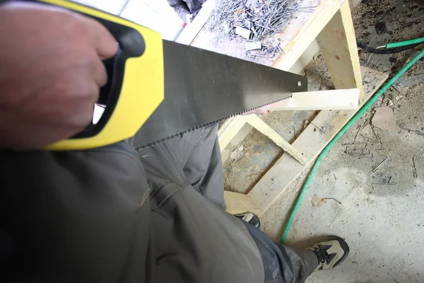 Worker with a saw — Stock Photo, Image