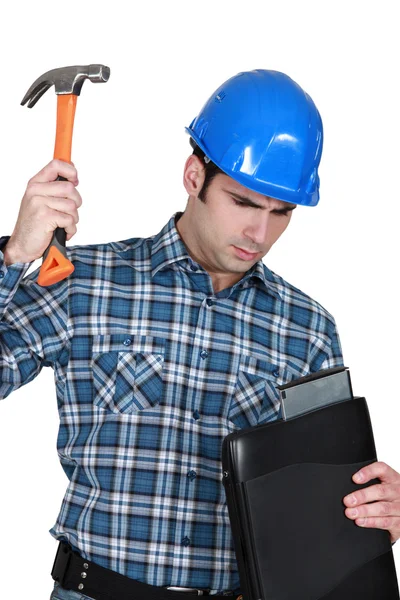 Tradesman hitting his laptop — Stock Photo, Image