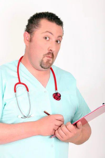 Doctor writing leaning on folders — Stock Photo, Image