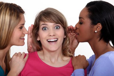 Two women whispering into friends ear clipart