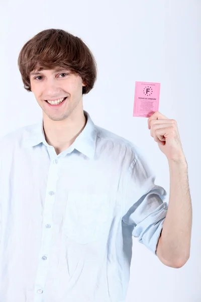 Jovem com carta de condução — Fotografia de Stock