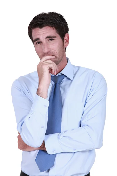 Pensive businessman rubbing chin — Stock Photo, Image