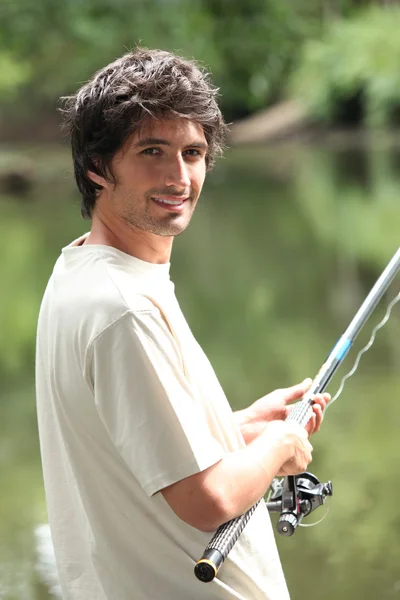 Man fishing aby lake Royalty Free Stock Photos