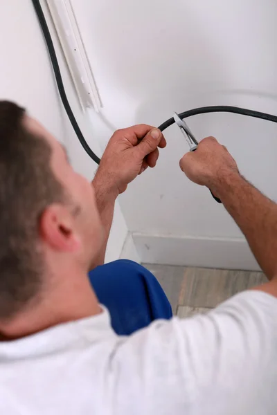 Electrician clipping a wire — Stock Photo, Image