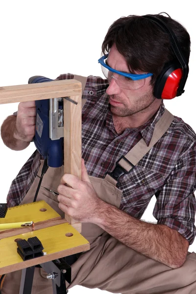 Man building a wooden frame — Stock Photo, Image