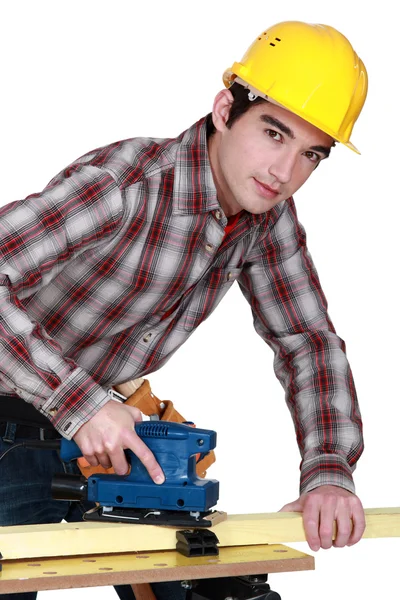 A trainee handling a jigsaw. — Stock Photo, Image