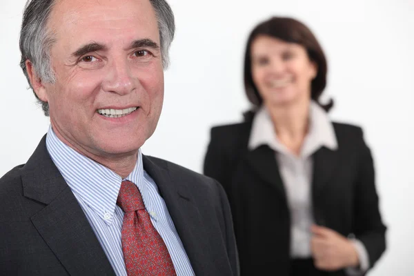 Velho empresário sorrindo — Fotografia de Stock