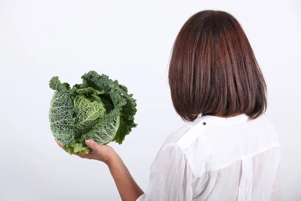 Woman holding a cabbage — Stock Photo, Image