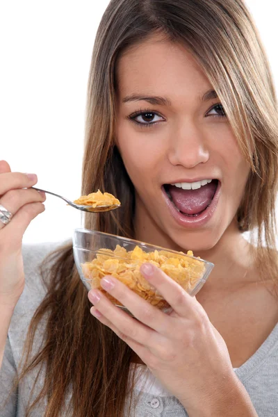 Beautiful young girl having breakfast — Stock Photo, Image