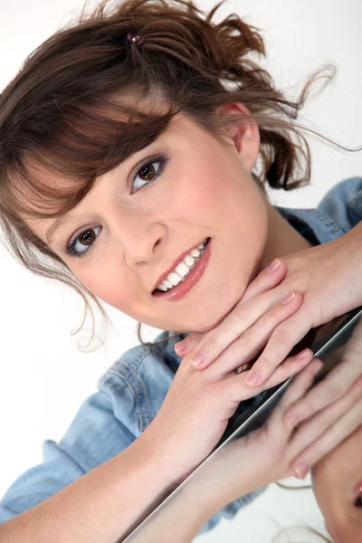 Smiling woman and her reflection — Stock Photo, Image