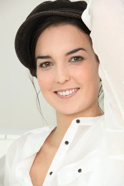 Brunette posing with hat — Stock Photo, Image