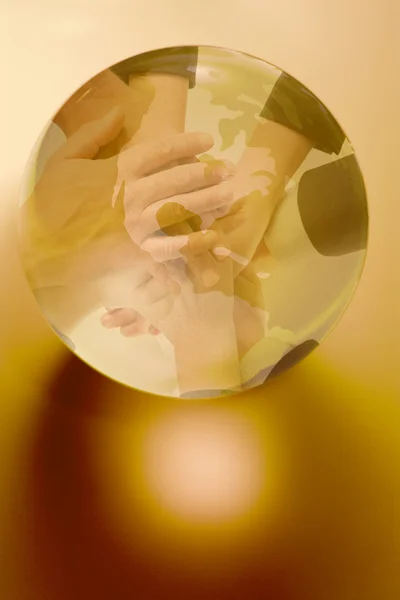 Hands around a globe — Stock Photo, Image